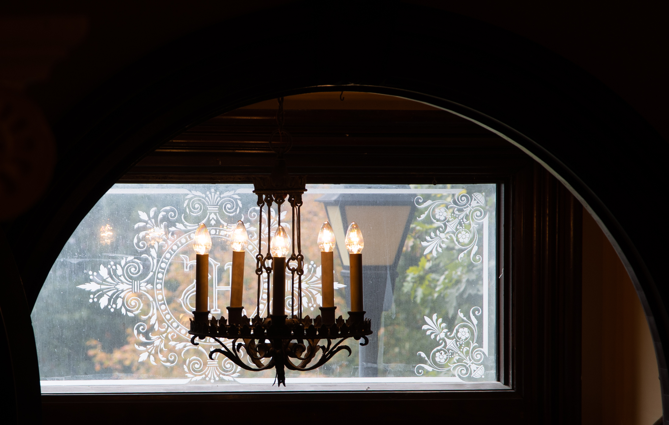 Entryway chandelier in window